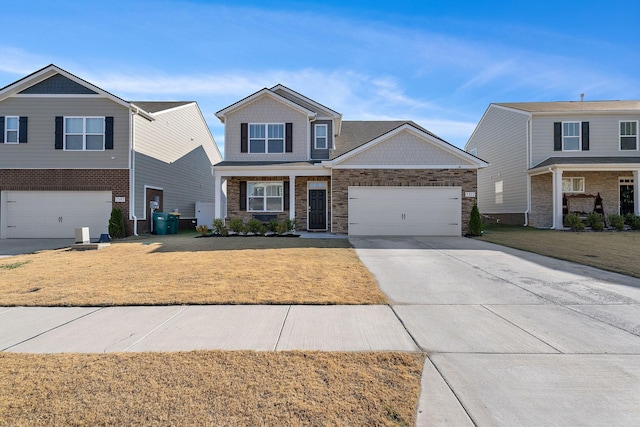 view of front of house with a front yard and a garage