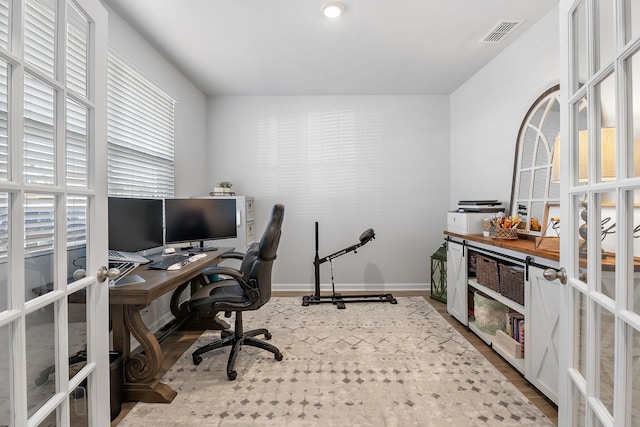 office with french doors and wood-type flooring