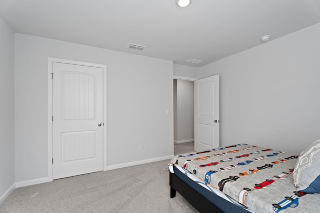 bedroom featuring light colored carpet