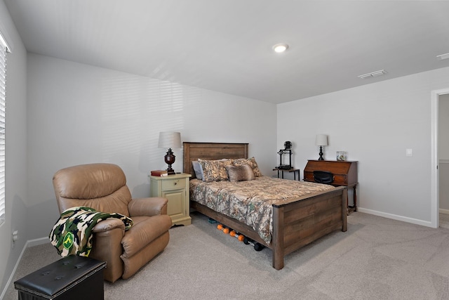 bedroom featuring light colored carpet