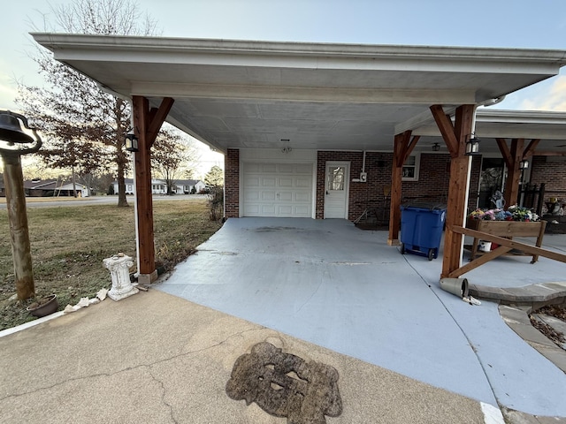 exterior space with a garage and a carport