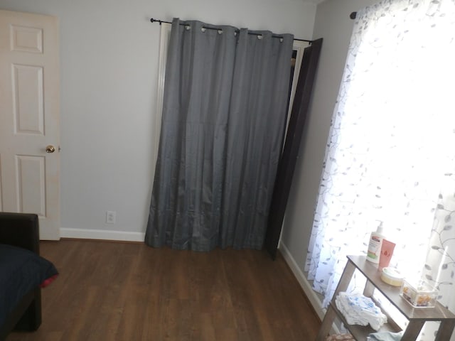 unfurnished room featuring dark hardwood / wood-style floors