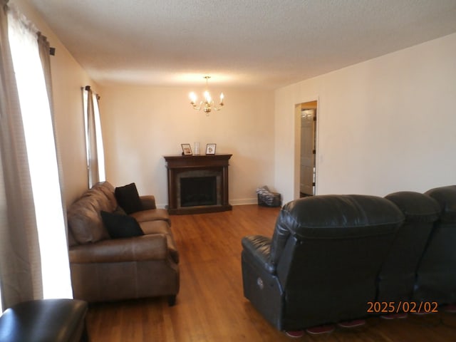 living room featuring hardwood / wood-style floors and a chandelier