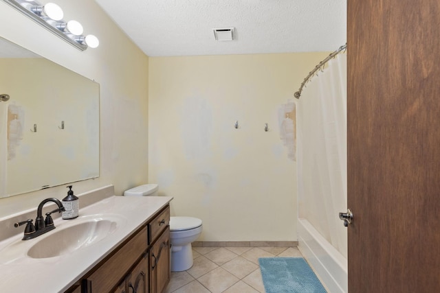 bathroom with vanity, a textured ceiling, tile patterned flooring, toilet, and curtained shower