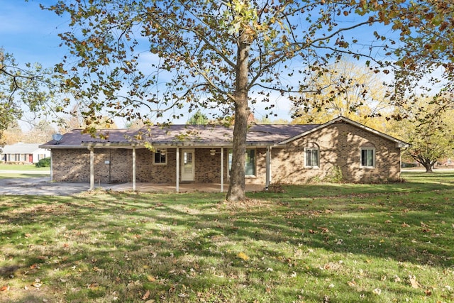 single story home with a patio and a front lawn