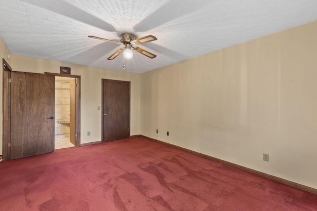 unfurnished bedroom with carpet flooring, ceiling fan, a textured ceiling, and ensuite bath