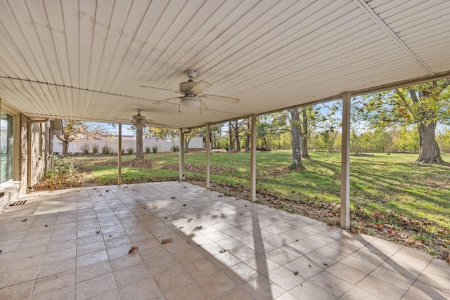 unfurnished sunroom with ceiling fan and wooden ceiling