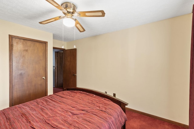 bedroom featuring a textured ceiling, carpet floors, a closet, and ceiling fan