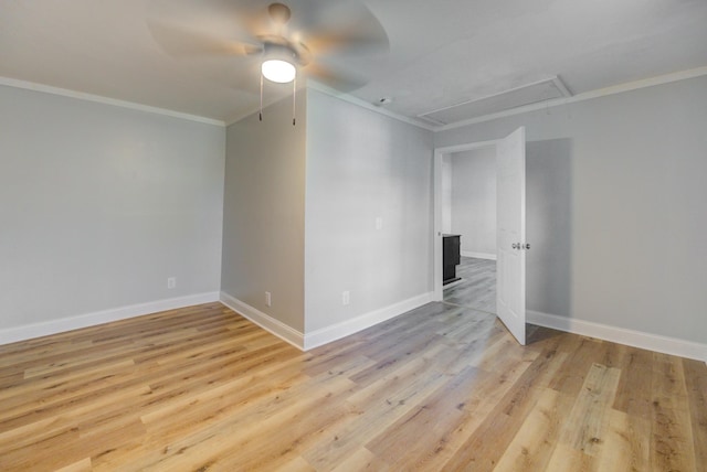 spare room featuring ceiling fan, crown molding, and light hardwood / wood-style flooring