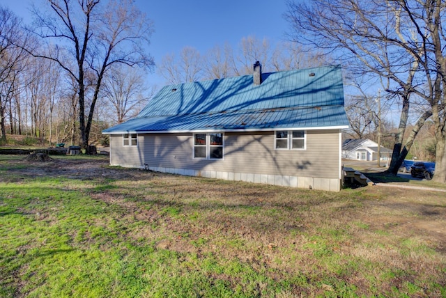70 Laneview Concord Rd, Trenton, TN 38382 - rear view of property featuring a metal roof, a chimney, and a lawn