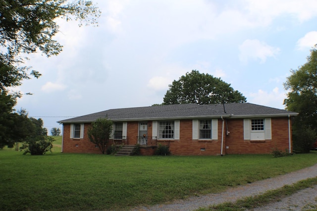 ranch-style house featuring a front yard