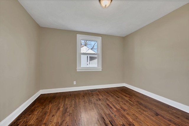 spare room featuring hardwood / wood-style flooring