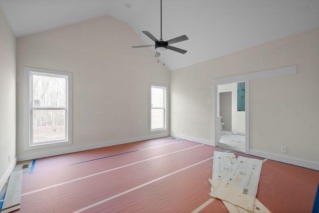 empty room with carpet flooring, ceiling fan, a healthy amount of sunlight, and high vaulted ceiling