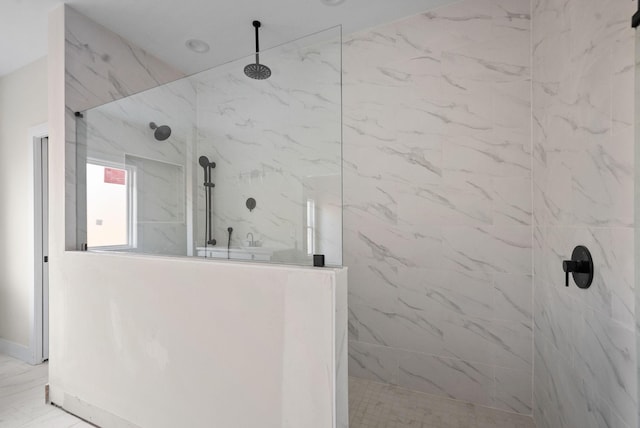 bathroom with a tile shower