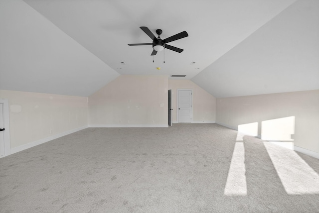 bonus room featuring light carpet, vaulted ceiling, and ceiling fan