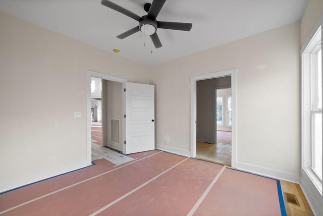 unfurnished bedroom with hardwood / wood-style flooring and ceiling fan