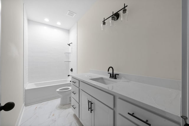 full bathroom with tiled shower / bath, vanity, and toilet