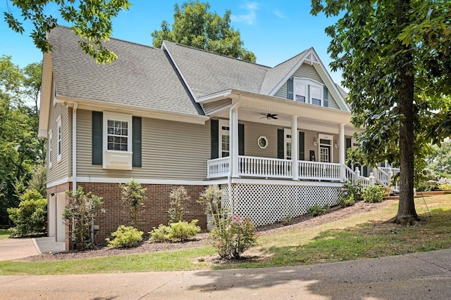 view of front of house featuring ceiling fan, a porch, and a garage