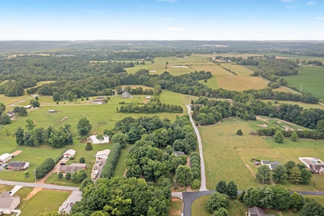 birds eye view of property with a rural view