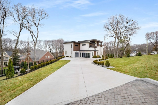 view of front of house with a garage and a front yard