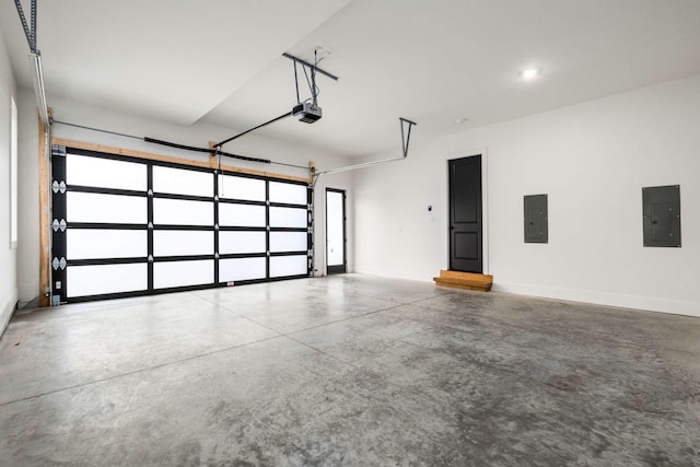 garage with electric panel and a garage door opener