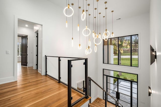 stairs with hardwood / wood-style floors