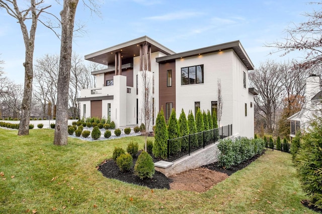 contemporary house with a front yard