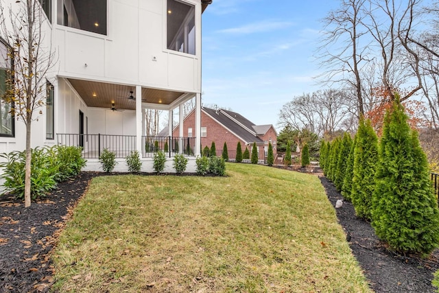 view of yard with ceiling fan