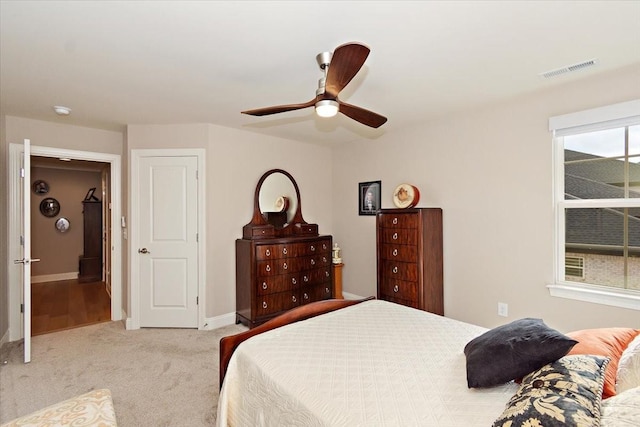 carpeted bedroom featuring ceiling fan