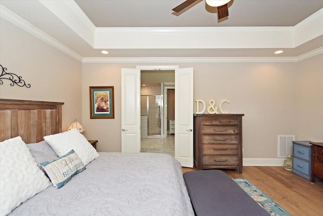 bedroom with ceiling fan, crown molding, and wood-type flooring