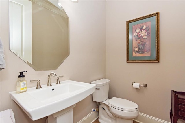 bathroom with toilet and sink