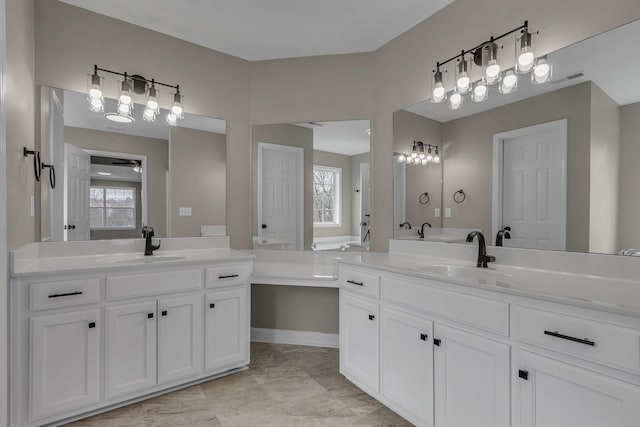 bathroom featuring vanity and plenty of natural light