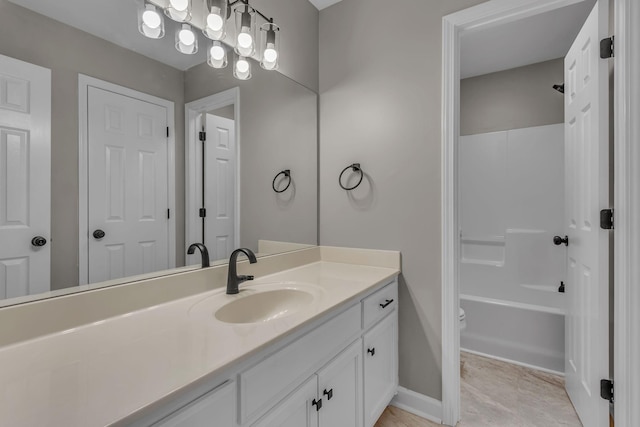 bathroom featuring tile patterned flooring, vanity, and shower / bath combination