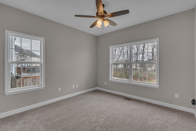 carpeted empty room with ceiling fan