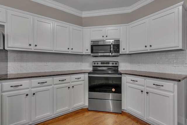 kitchen featuring white cabinetry, appliances with stainless steel finishes, and light hardwood / wood-style flooring