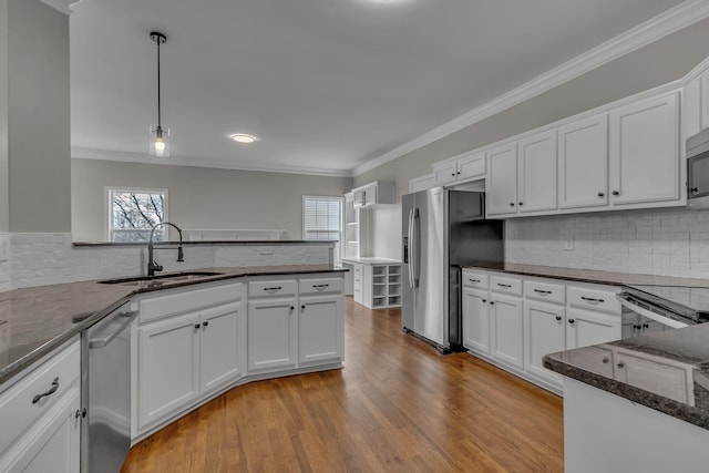 kitchen featuring a healthy amount of sunlight and white cabinetry