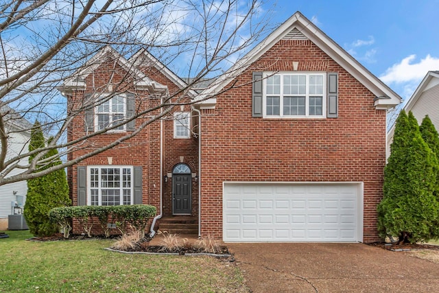 view of property with a front yard, central AC, and a garage