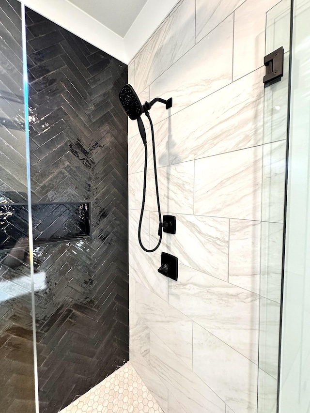 bathroom with tiled shower