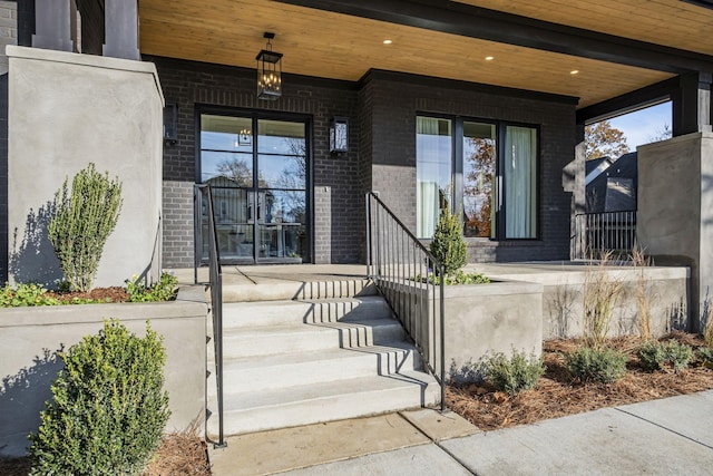 property entrance with covered porch