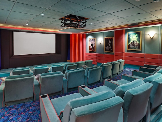 cinema room with a paneled ceiling