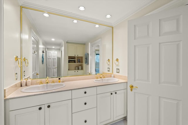 bathroom featuring double vanity, ornamental molding, a sink, and recessed lighting