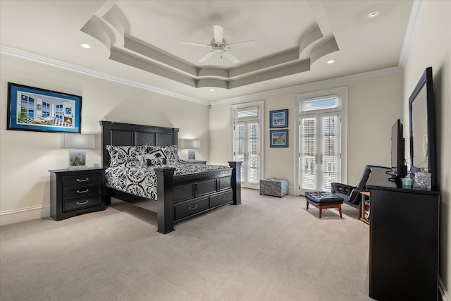 bedroom with light carpet, baseboards, ornamental molding, and a raised ceiling