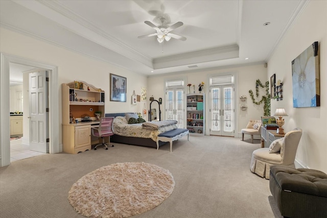 bedroom featuring access to exterior, french doors, crown molding, a raised ceiling, and light colored carpet