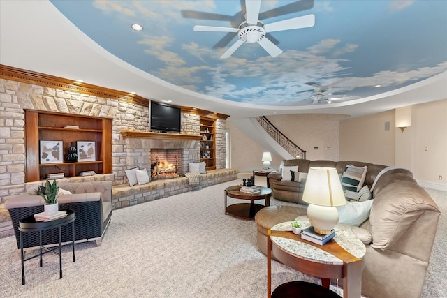 carpeted living area with recessed lighting, ceiling fan, and a lit fireplace