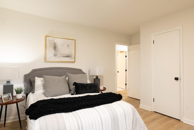 bedroom with light wood-type flooring