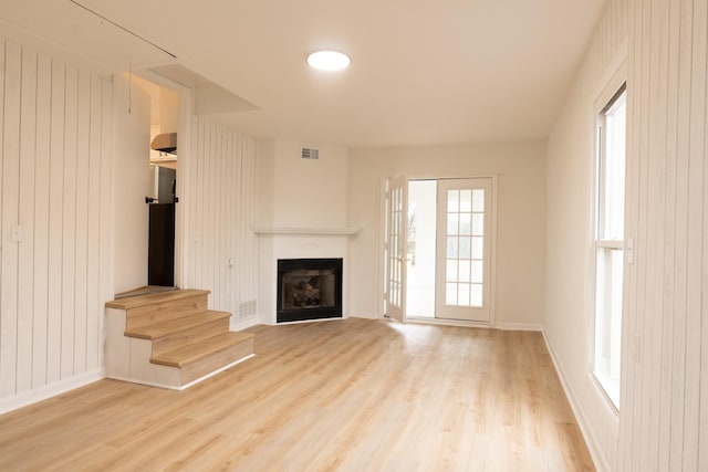 unfurnished living room featuring light hardwood / wood-style floors