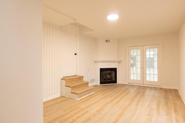 unfurnished living room featuring light hardwood / wood-style floors