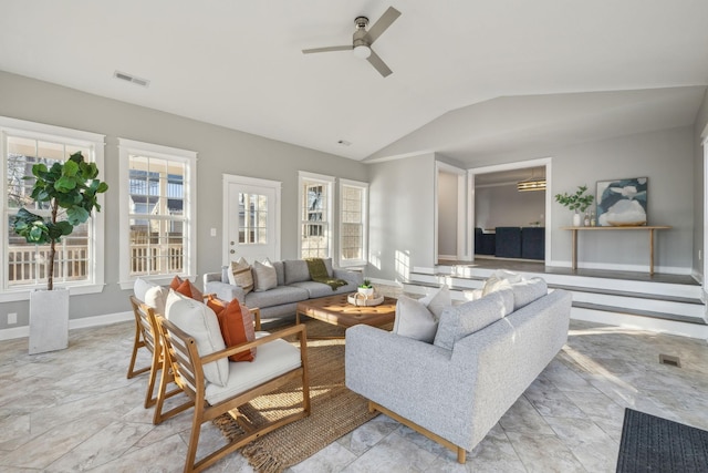 living room featuring ceiling fan and lofted ceiling