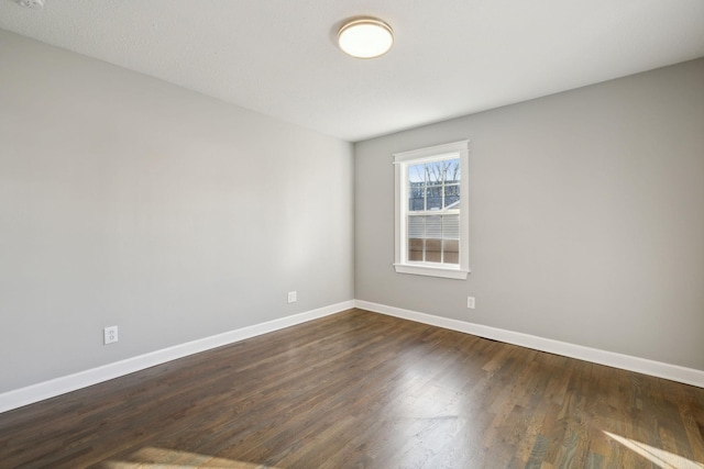 empty room featuring dark hardwood / wood-style floors