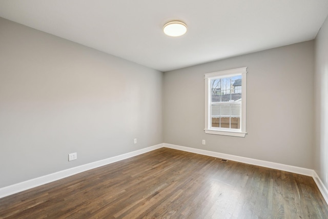 empty room featuring dark hardwood / wood-style floors